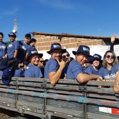 About 20 people in the back of a truck